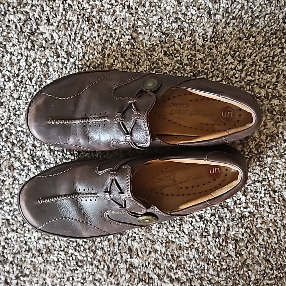Clarks Unstructured dark brown slip ons